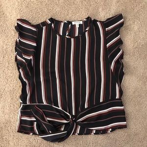 Cute black, red, white top. Fits like a medium.